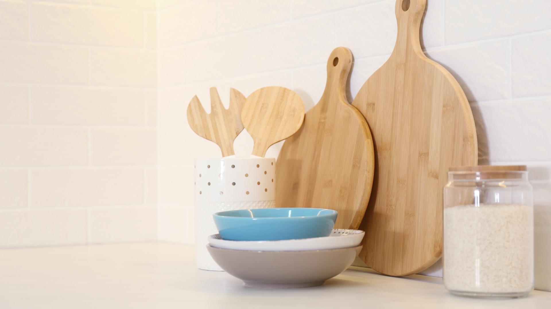 Neatly arranged wooden kitchenware in a modern, minimalist kitchen, reflecting the growing consumer preference for sustainable products