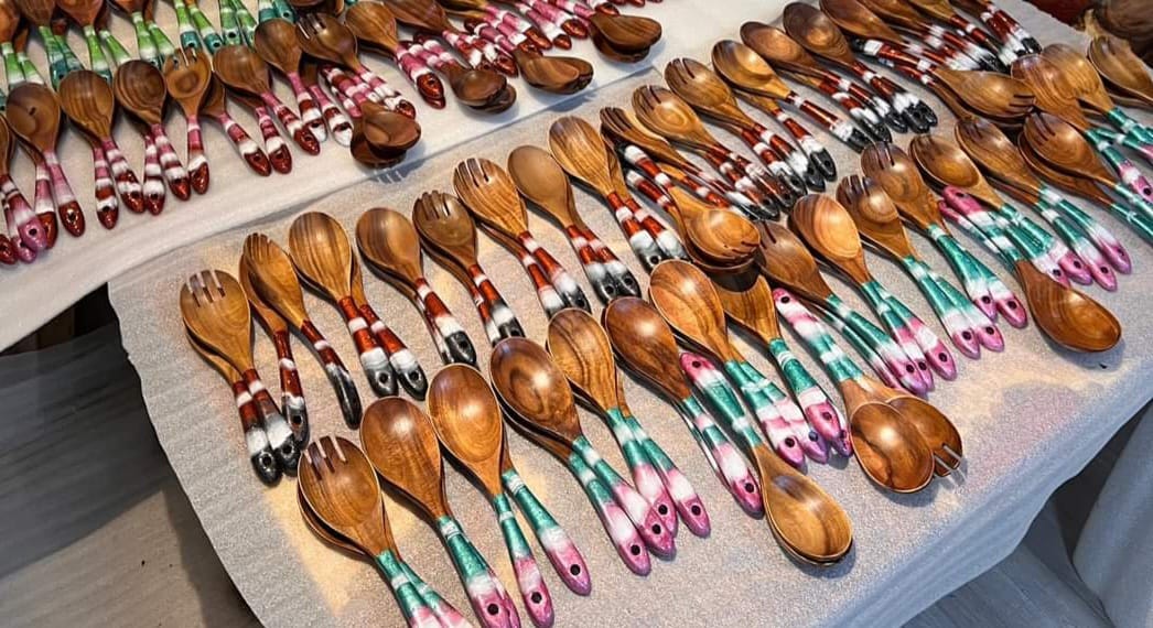 A set of finely crafted wooden utensils from a trusted manufacturer, designed for durability and sustainability