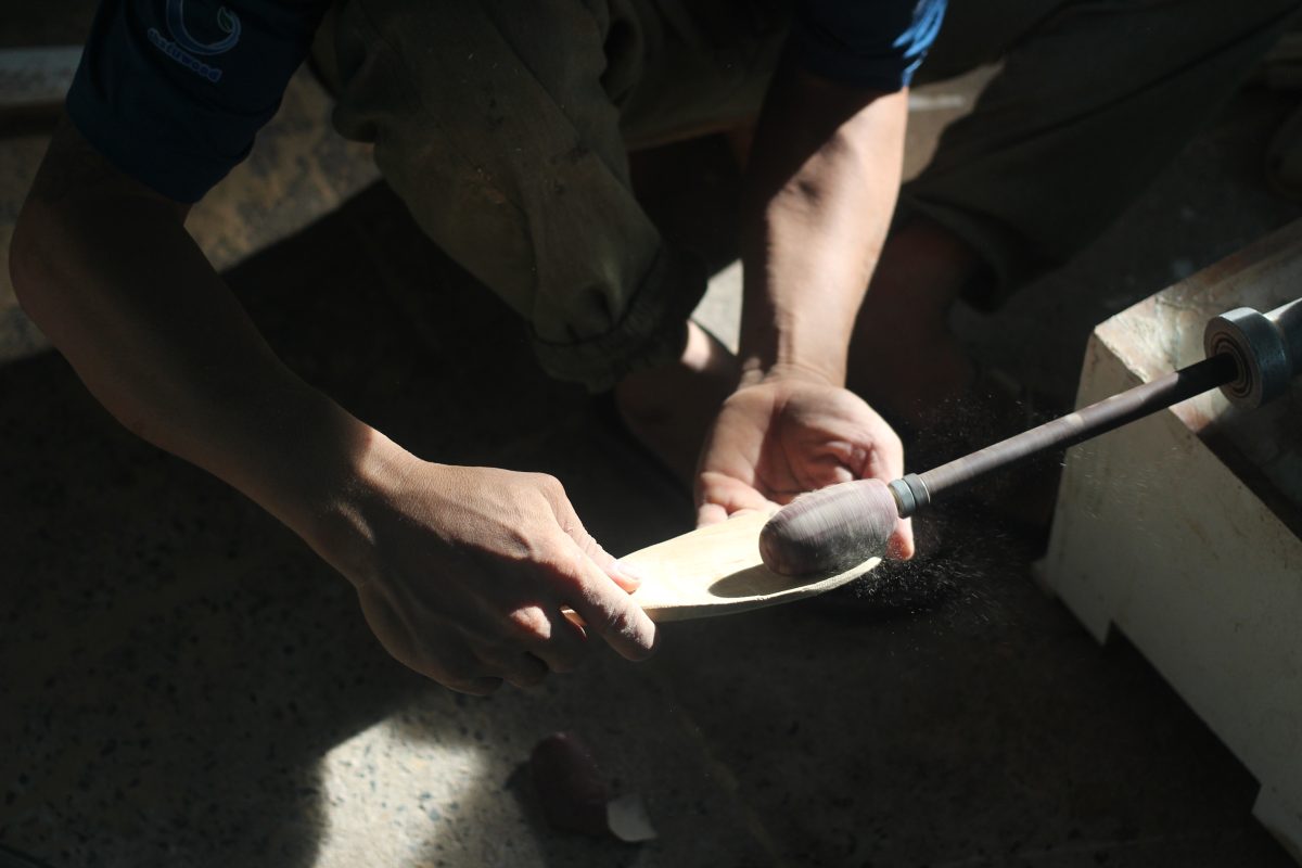Skillful craftmen are treatment wooden cutlery