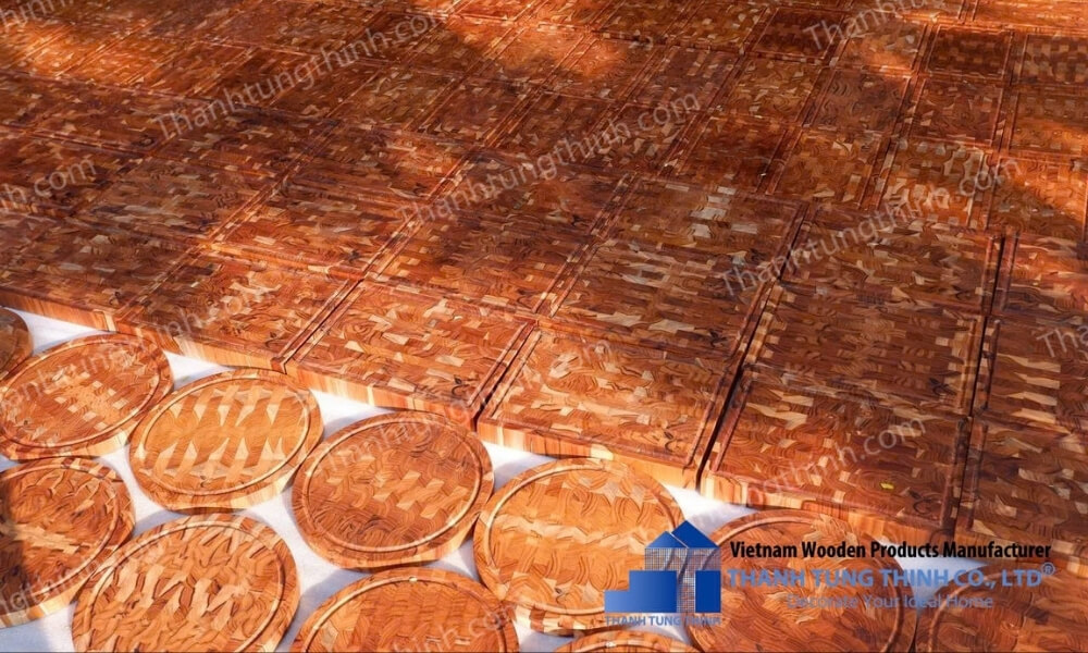Stack of teak wooden cutting boards ready for bulk supply and international shipping