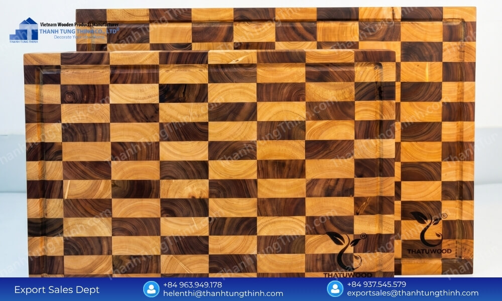 Finished custom-branded chopping blocks ready for bulk export shipment from a premier teak wood cutting board supplier
