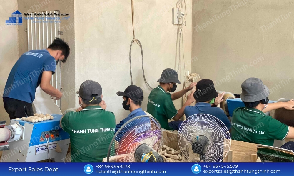A line of manufacturing artisans seated at high-speed sanding machinery polishing uniform wooden pet items and raw materials