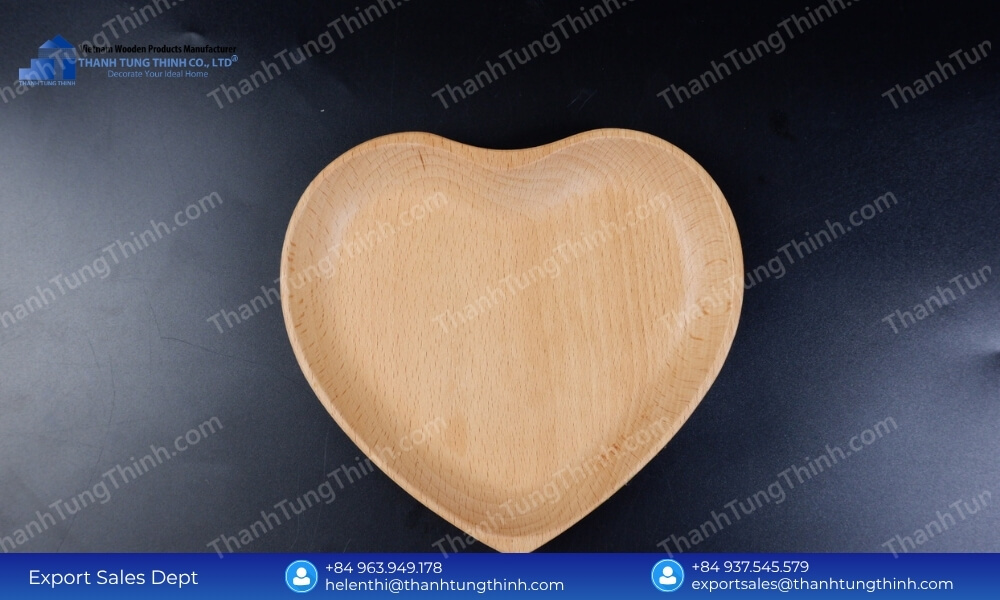 A custom heart shaped wooden dish highlighting our capacity to offer a customized wholesale wood plates MOQ for unique brand launches