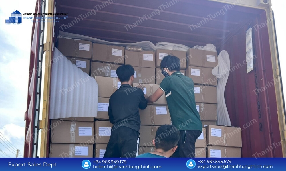 Logistics team loading a shipping container with master cartons to fulfill a large wholesale wood plates MOQ order