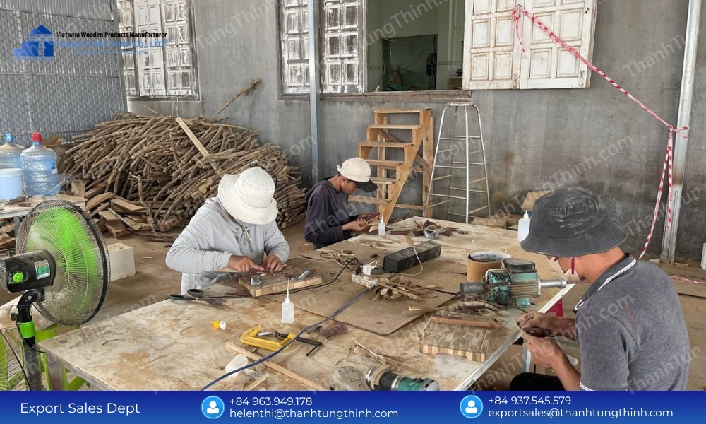 Skilled factory technicians conducting visual inspections and smoothing edges as part of the mass production wooden forks