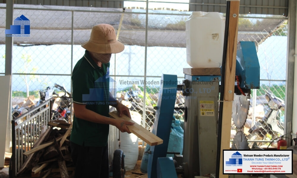 Factory worker processing raw timber to prepare base patterns for wooden jewelry boxes