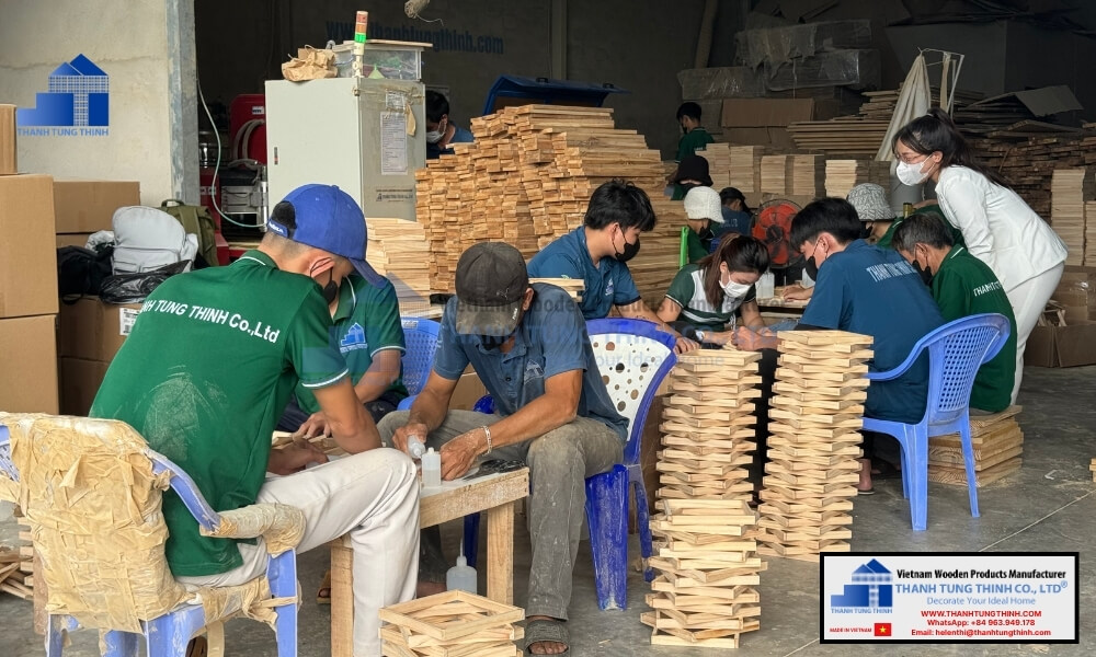 Skilled artisans assembling components at luxury wooden jewelry packaging vendors workshop