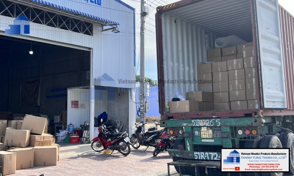 Workers loading export containers with wholesale tableware shipments at a certified bulk wooden plates factory warehouse