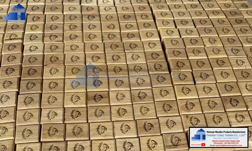 A high volume collection of wholesale wooden rings storage organizers featuring detailed laser engraved patterns on the lids