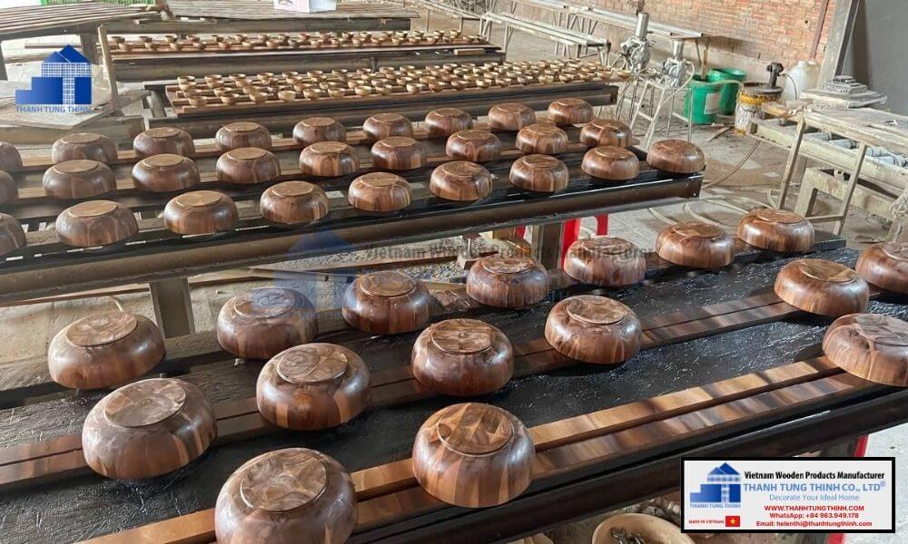 mass production line of food safe wholesale wooden bowl units in a manufacturing facility