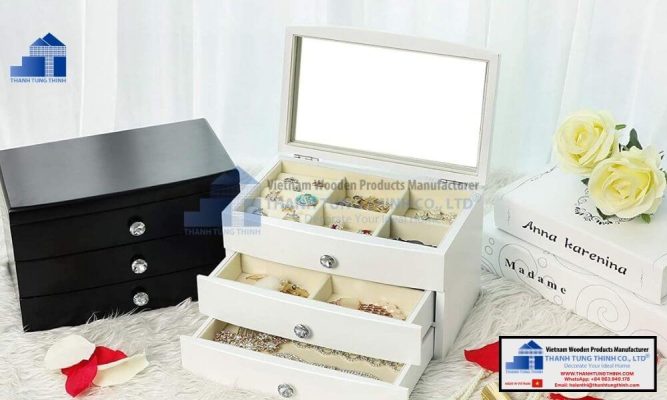 White and black multi tier personalized wooden jewelry boxes displayed with decor