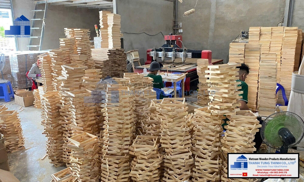 automated machining and stacks of plain wooden jewelry boxes in factory